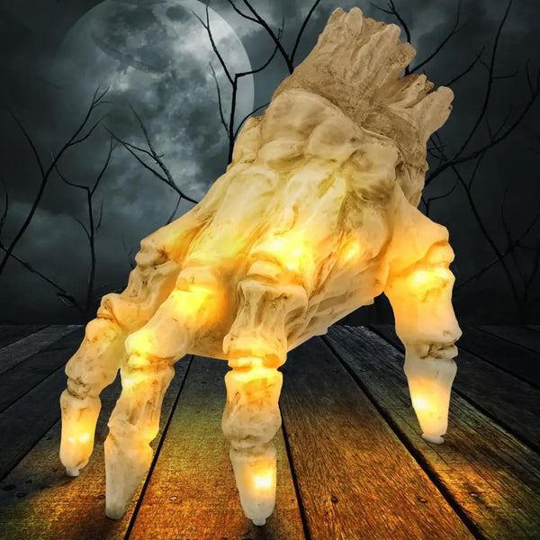 Kriechende Skeletthand mit Licht und Sound